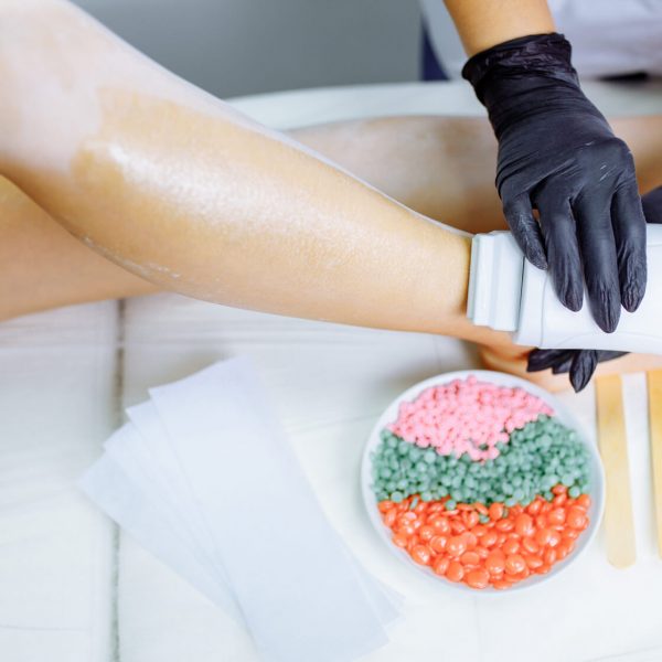sugaring-woman-at-cosmetics-salon-waxing-legs-2022-04-11-22-02-51-utc