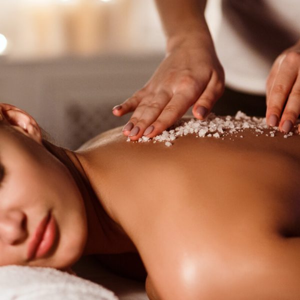 woman-enjoying-salt-scrub-massage-at-spa-2022-10-07-01-30-40-utc