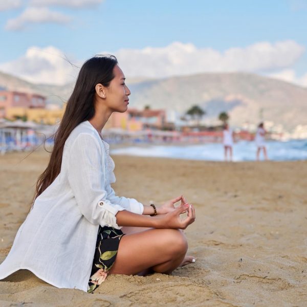 young-woman-practicing-yoga-on-the-beach-2022-03-29-23-50-50-utc young-woman-practicing-yoga-on-the-beach-2022-03-29-23-50-50-utc